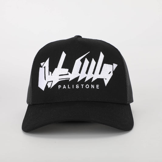 Embroidered Palestinian cap with ‘Palestine’ text in Arabic, black and white keffiyeh design.