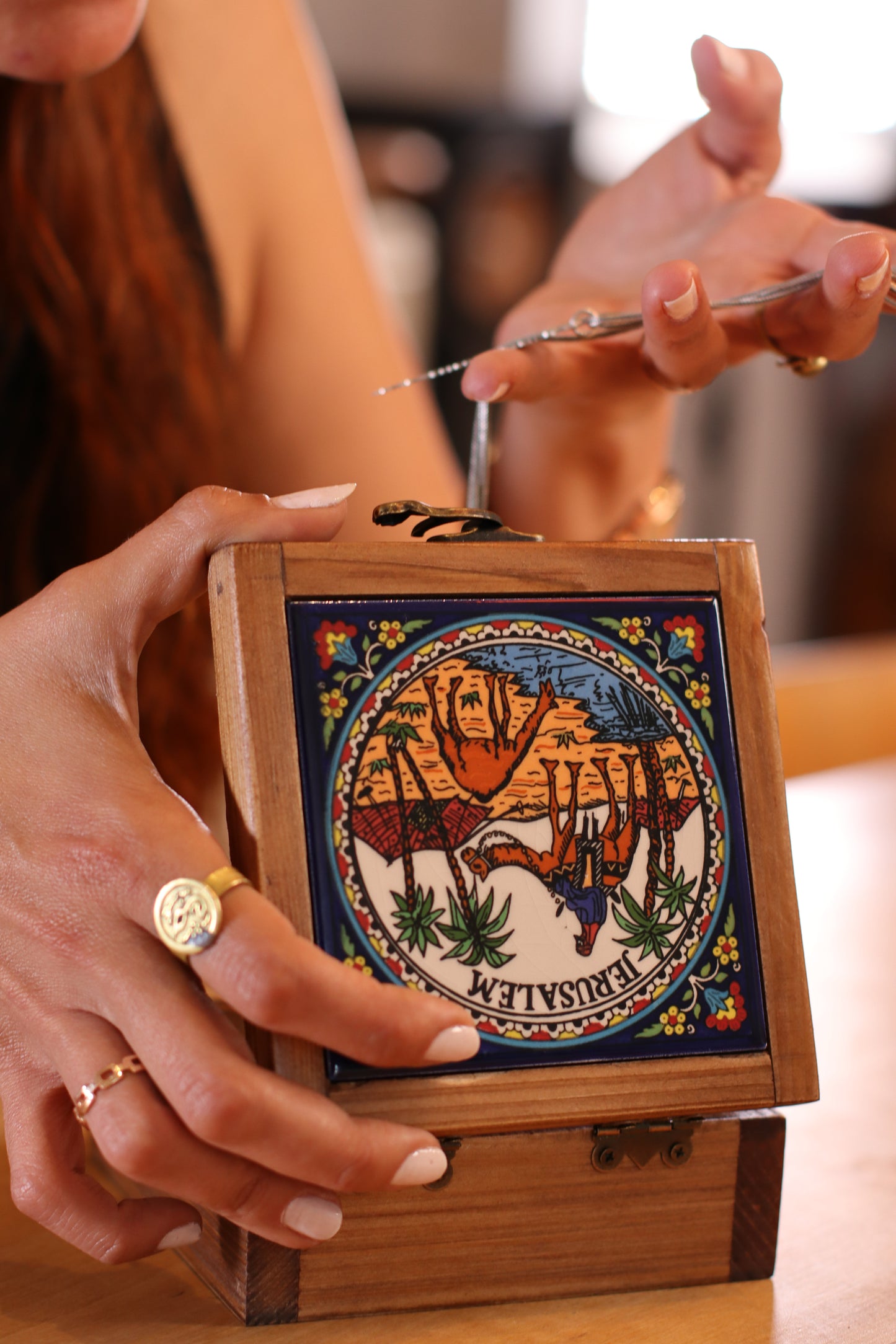 a girl using handcrafted wooden box from Hebron, Palestine, Ceramic box - palistone brand