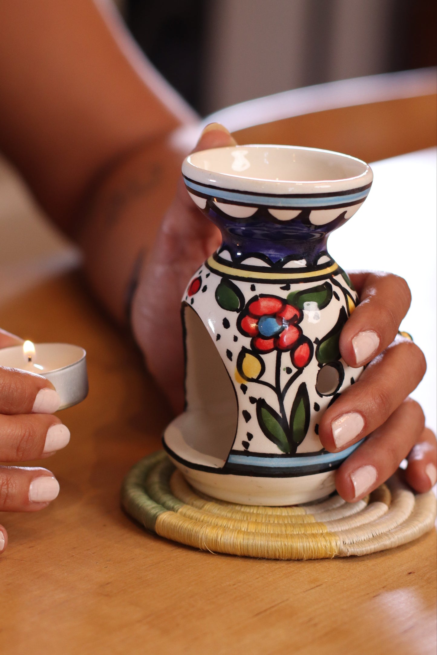 handmade ceramic incense burner from Hebron, Palestine, beautifully painted with watercolor floral designs. A perfect blend of traditional craftsmanship and artistic beauty