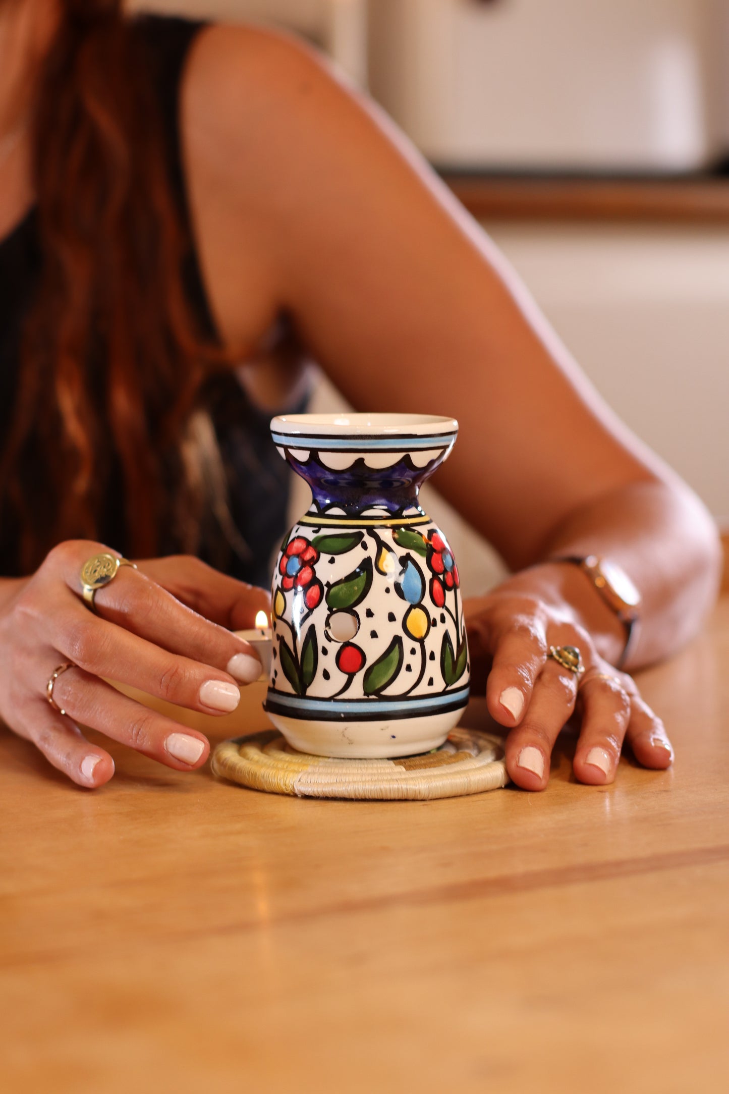 handmade ceramic incense burner from Hebron, Palestine, beautifully painted with watercolor floral designs. A perfect blend of traditional craftsmanship and artistic beauty
