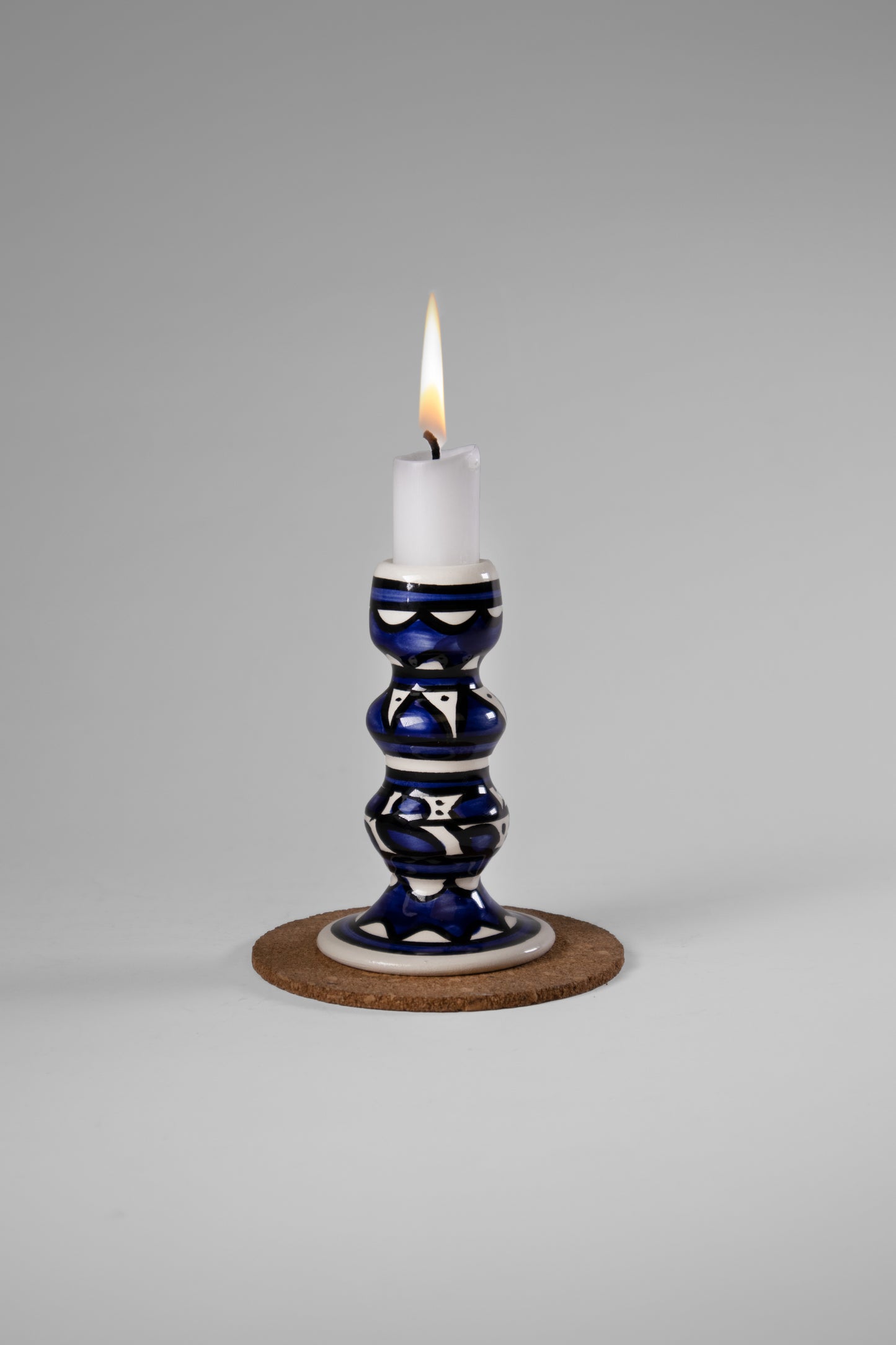 Hand-painted candle holder crafted in Palestine with delicate watercolor designs, perfect for adding a cultural and artistic touch to any space.”