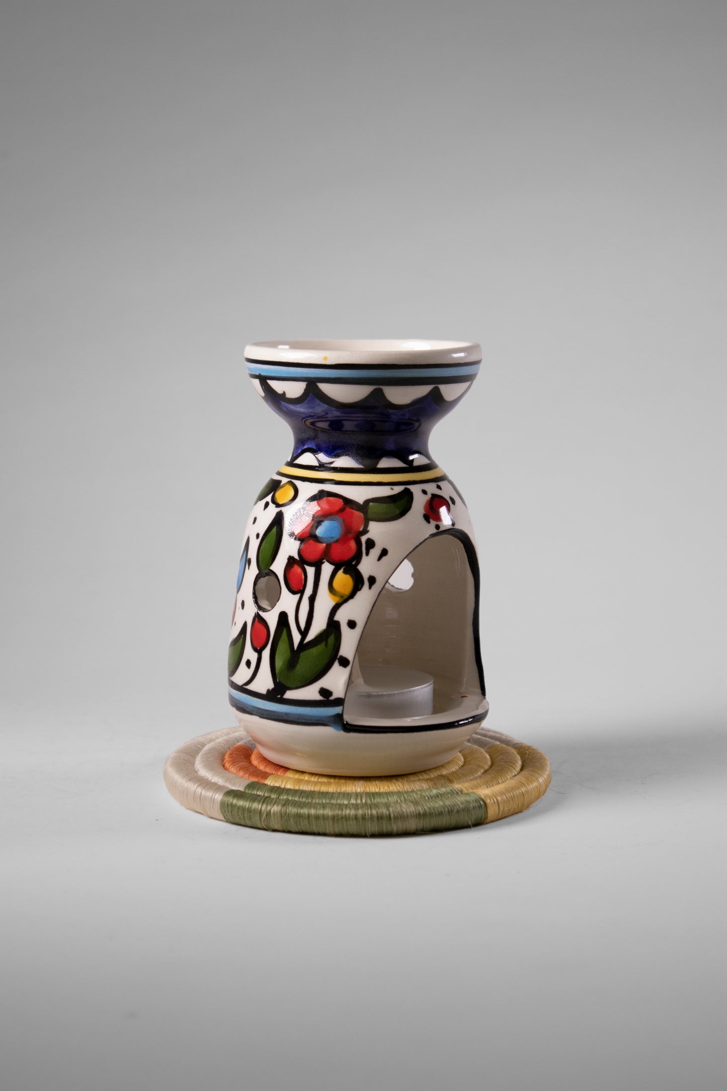 handmade ceramic incense burner from Hebron, Palestine, beautifully painted with watercolor floral designs. A perfect blend of traditional craftsmanship and artistic beauty