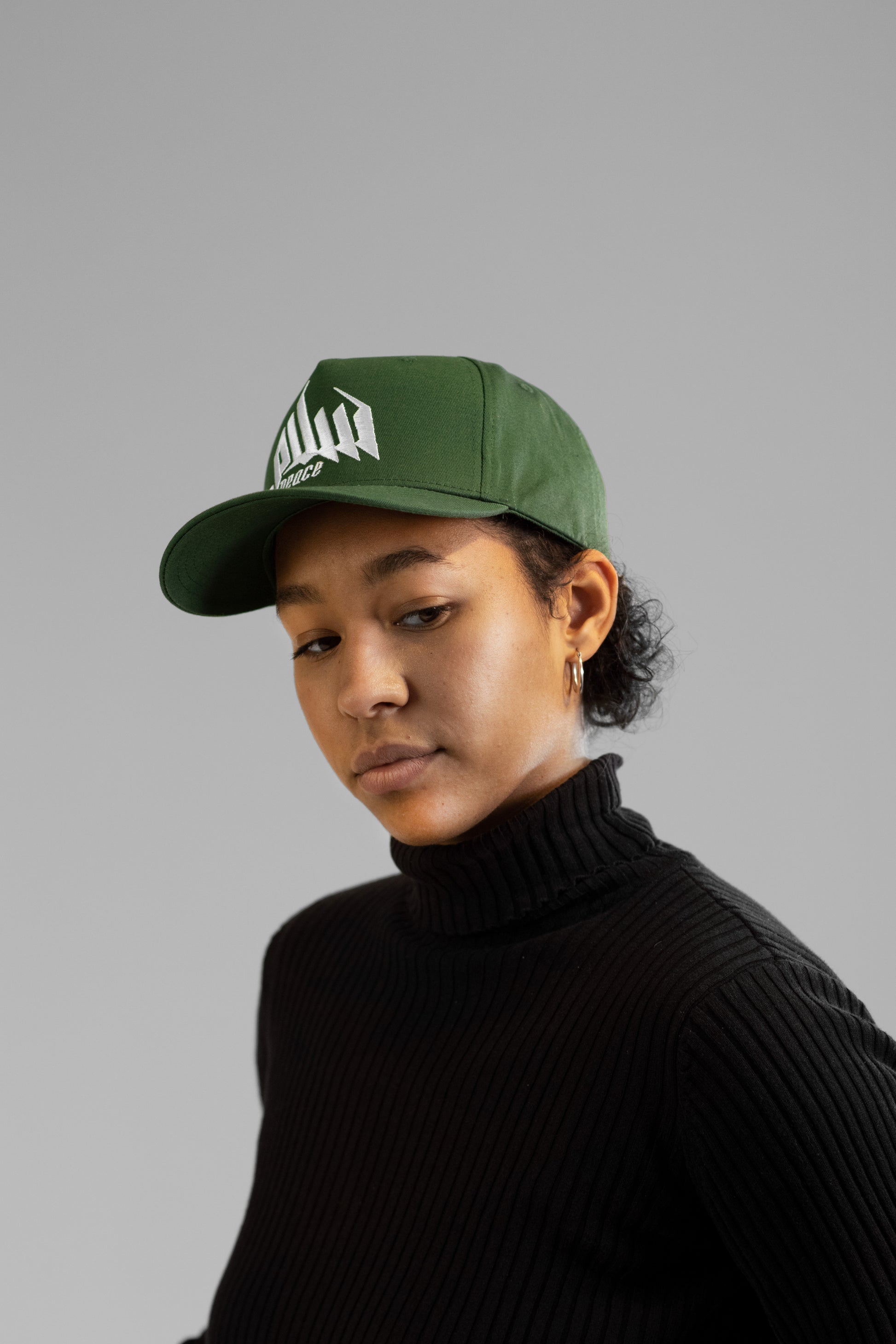Embroidered Palestinian cap with ‘Peace & Freedom for Palestine’ text, inspired by Palestinian heritage and cultural resilience. Stylish and meaningful headwear for solidarity and justice