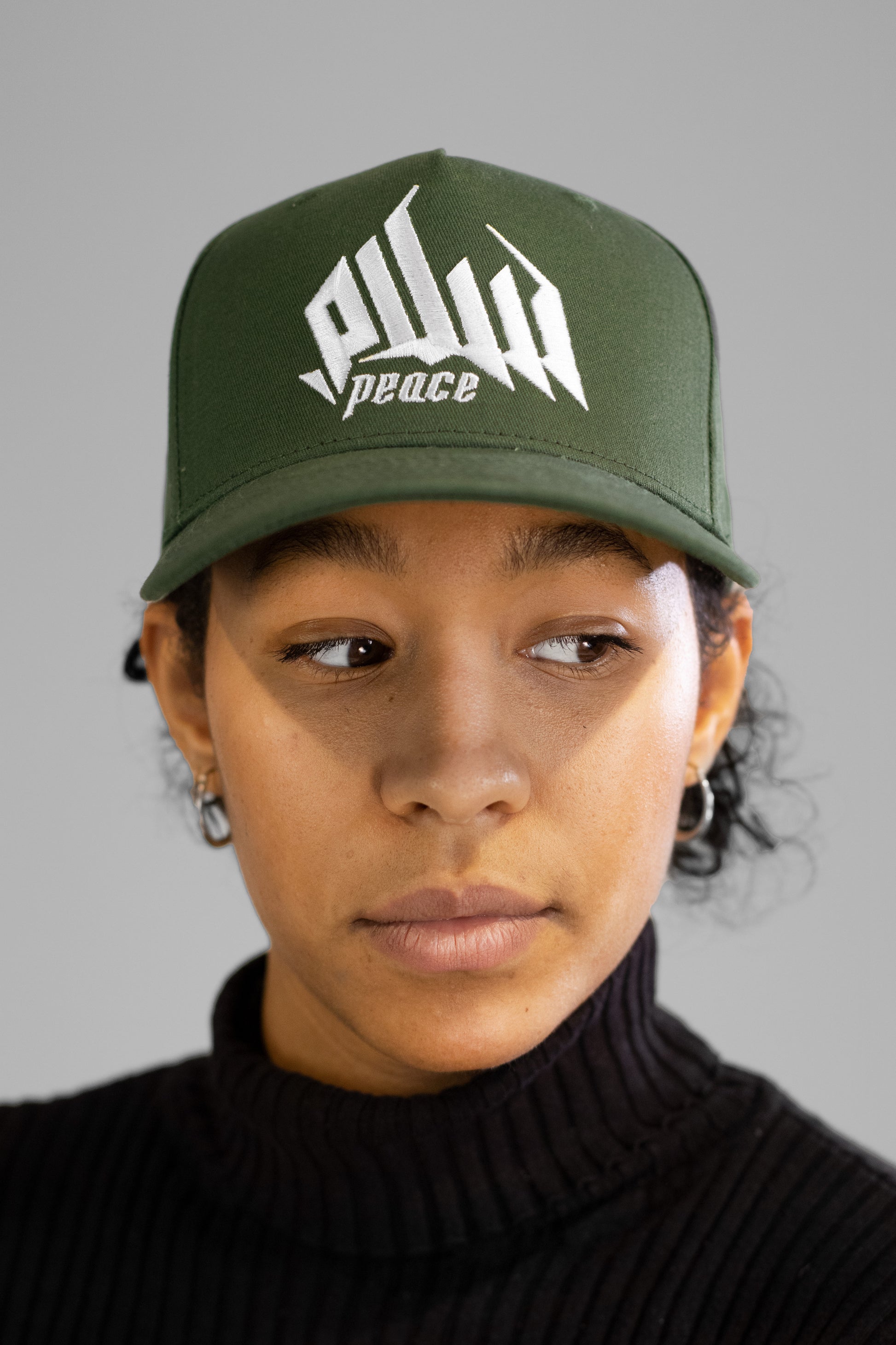 Embroidered Palestinian cap with ‘Peace & Freedom for Palestine’ text, inspired by Palestinian heritage and cultural resilience. Stylish and meaningful headwear for solidarity and justice