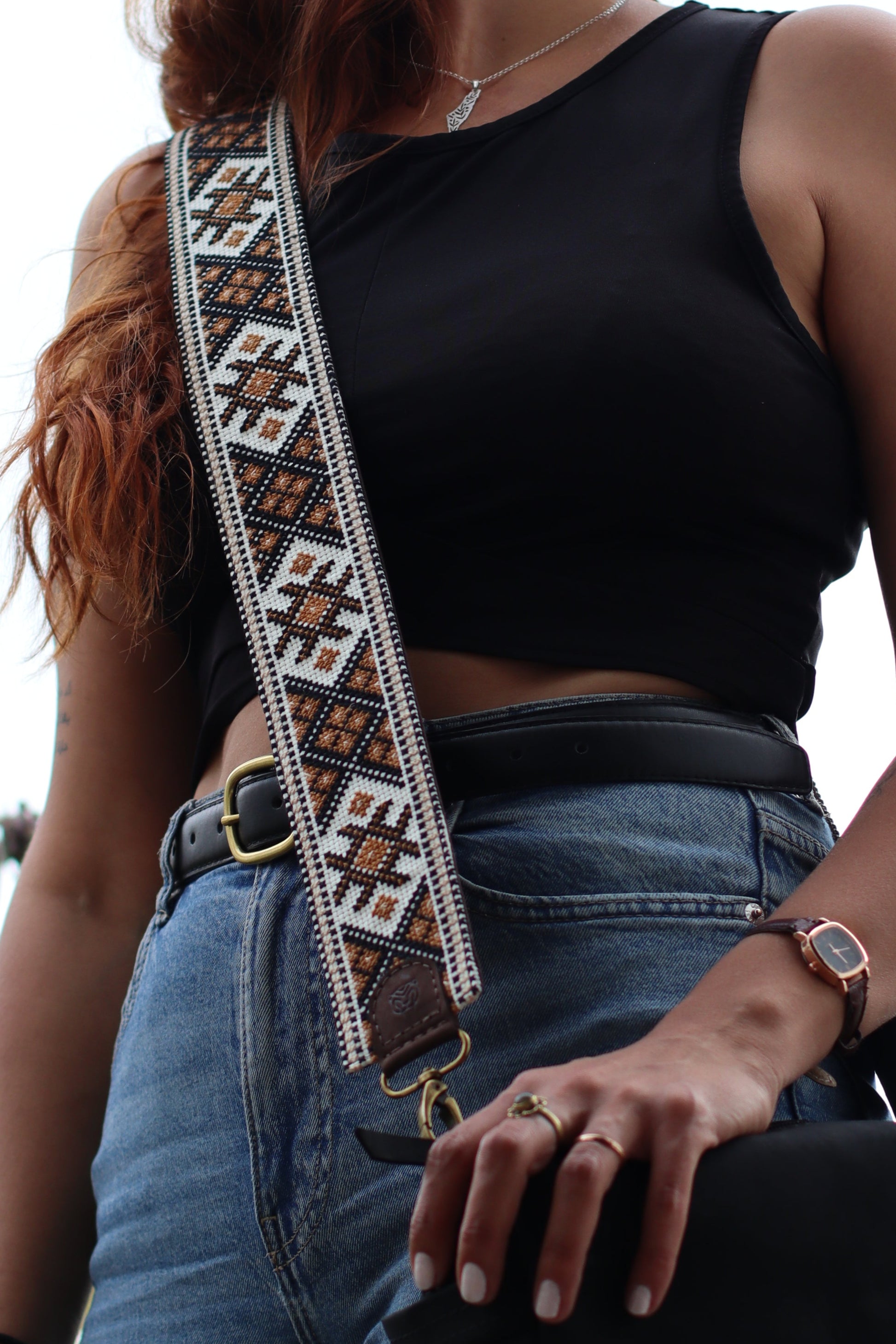 A Girl wearing a Handmade leather belt with traditional embroidery from Hebron, Palestine, PaliStone brand.