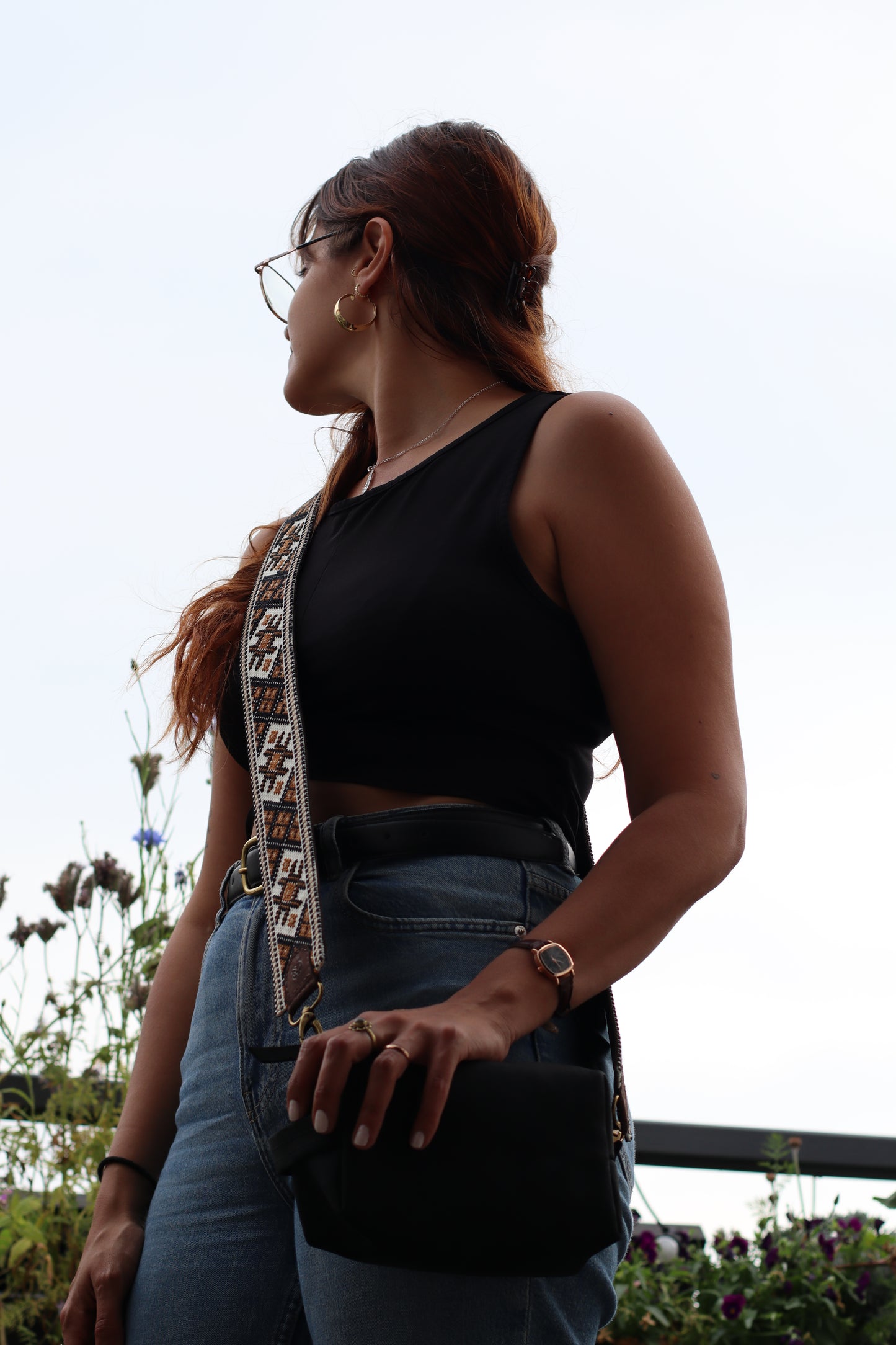 A Girl wearing a Handmade leather belt with traditional embroidery from Hebron, Palestine, PaliStone brand.