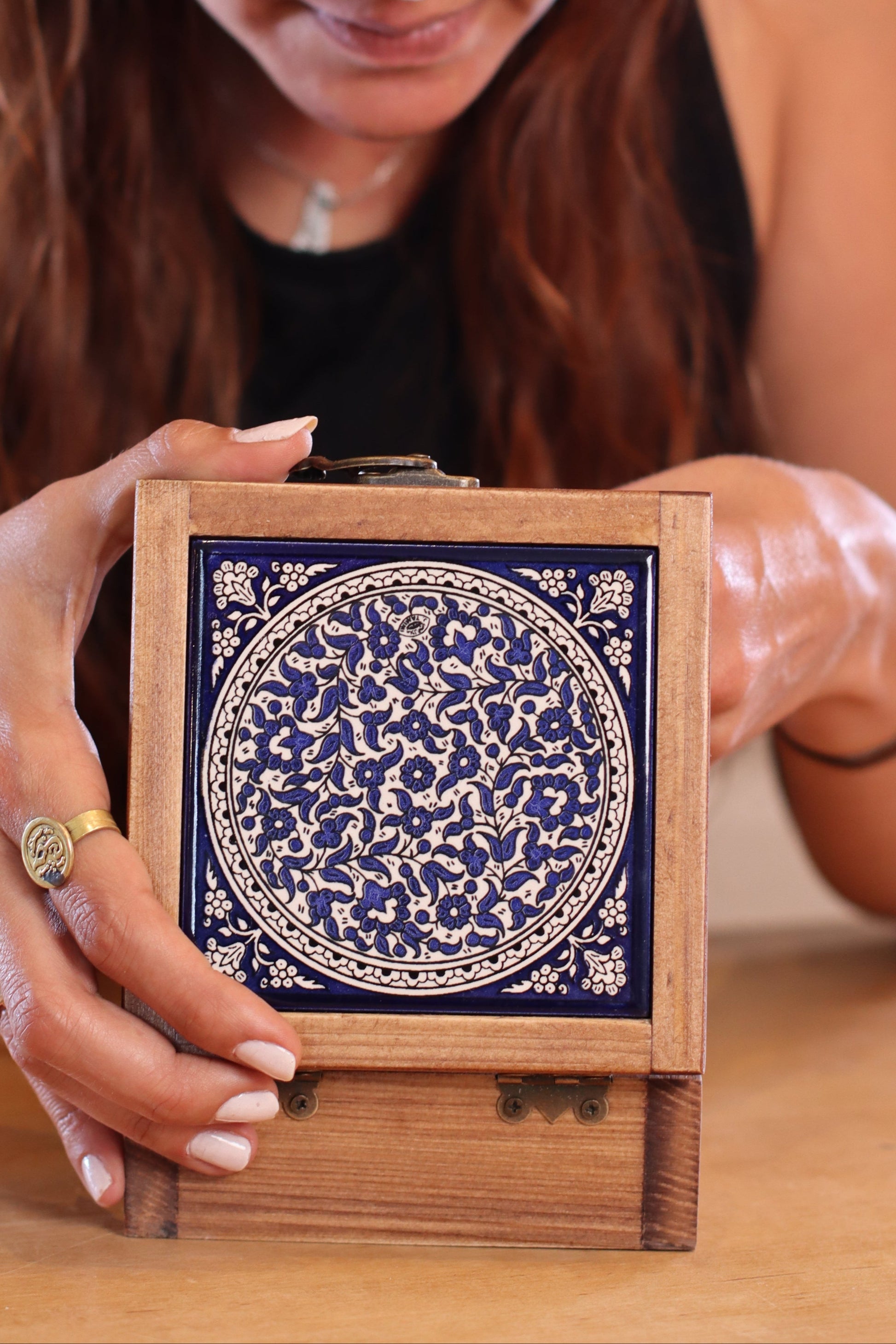 A girl using a handcrafted wooden box from Hebron, Palestine, Ceramic box - palistone brand
