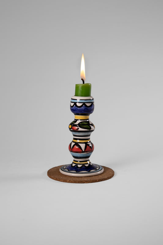 Hand-painted candle holder crafted in Palestine with delicate watercolor designs, perfect for adding a cultural and artistic touch to any space.”