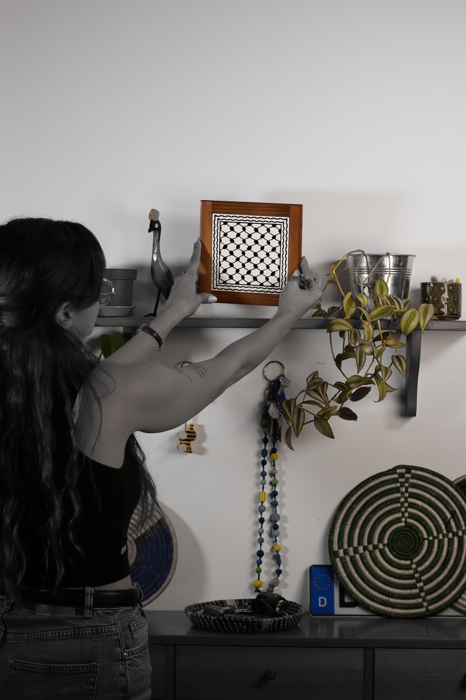 “Handcrafted wooden frame from Hebron, Palestine, featuring intricate ceramic decorations and vibrant, bold colors, showcasing traditional Palestinian craftsmanship.” palistone brand