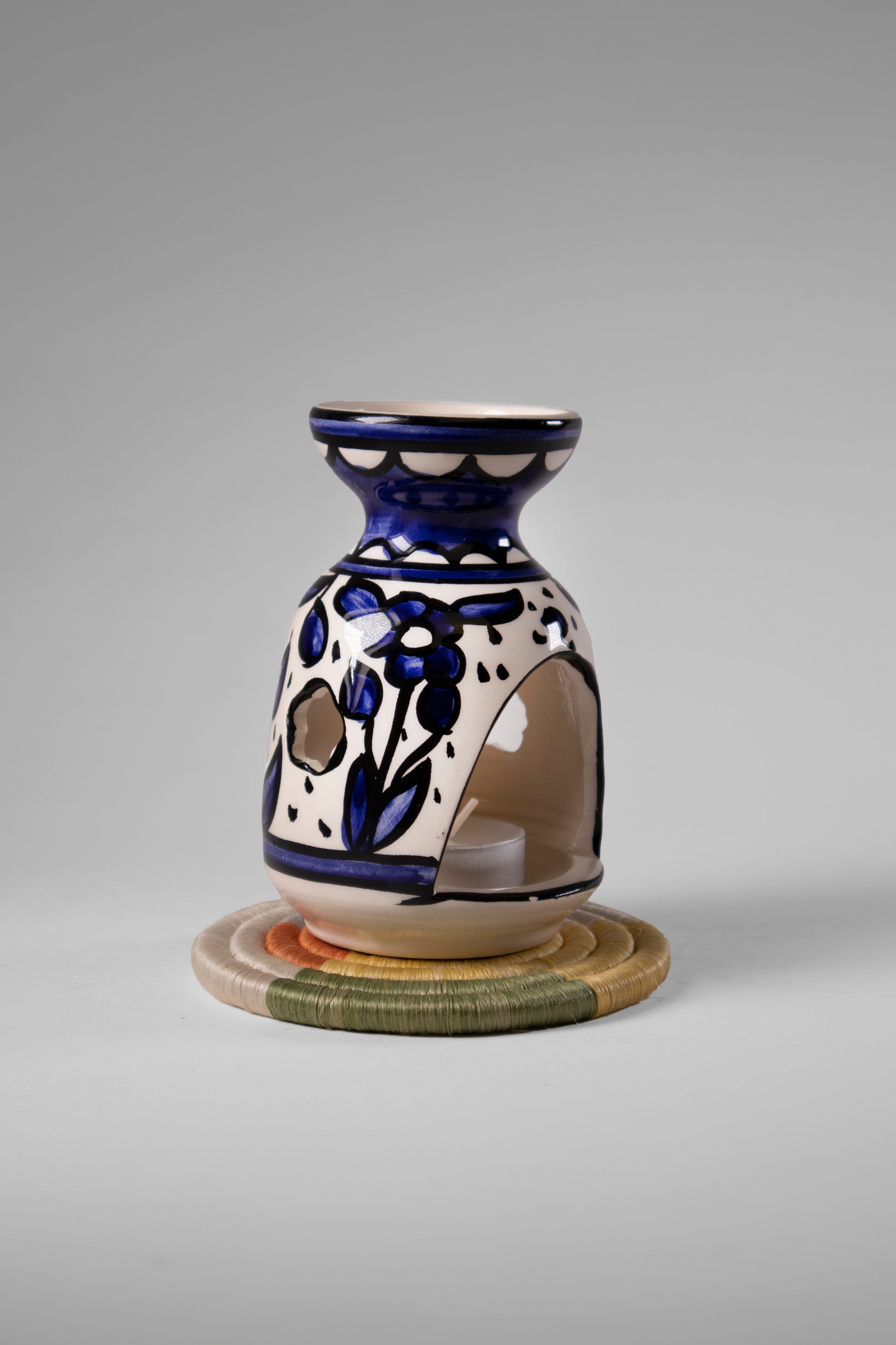 handmade ceramic incense burner from Hebron, Palestine, beautifully painted with watercolor floral designs. A perfect blend of traditional craftsmanship and artistic beauty