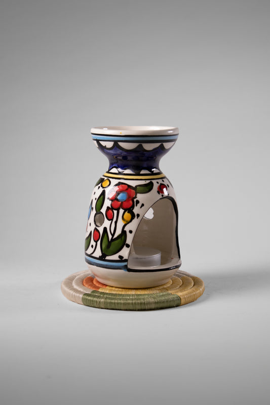 handmade ceramic incense burner from Hebron, Palestine, beautifully painted with watercolor floral designs. A perfect blend of traditional craftsmanship and artistic beauty